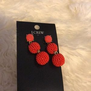 Red statement earrings
